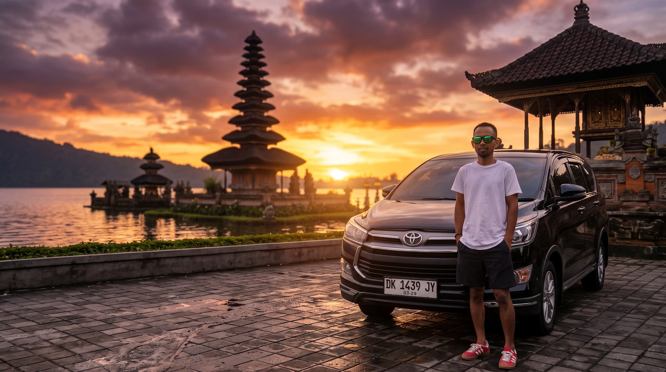 Private driver standing beside vehicle ready for a Bali tour